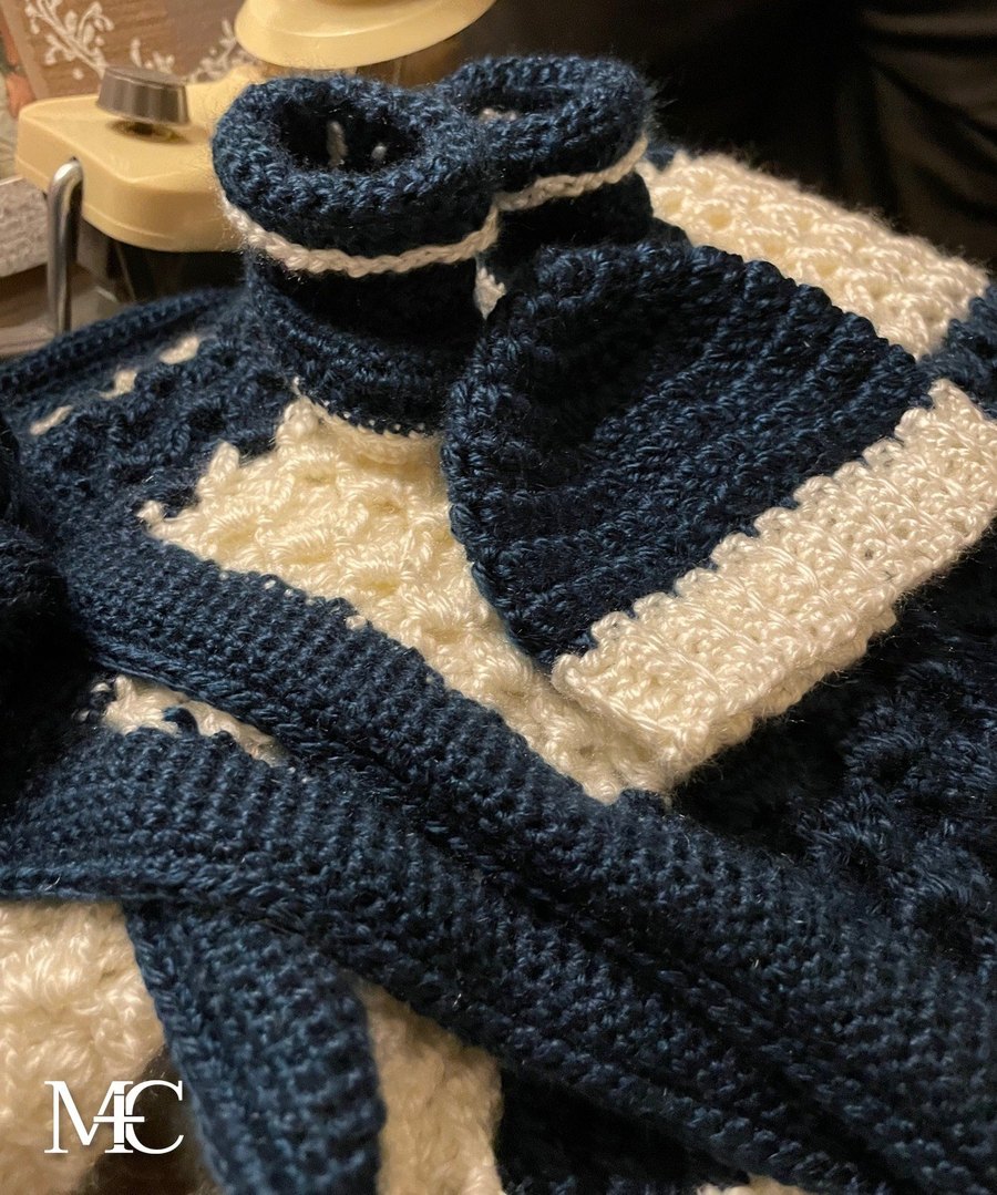 Handmade crochet baby blanket, hat and booties in navy and cream